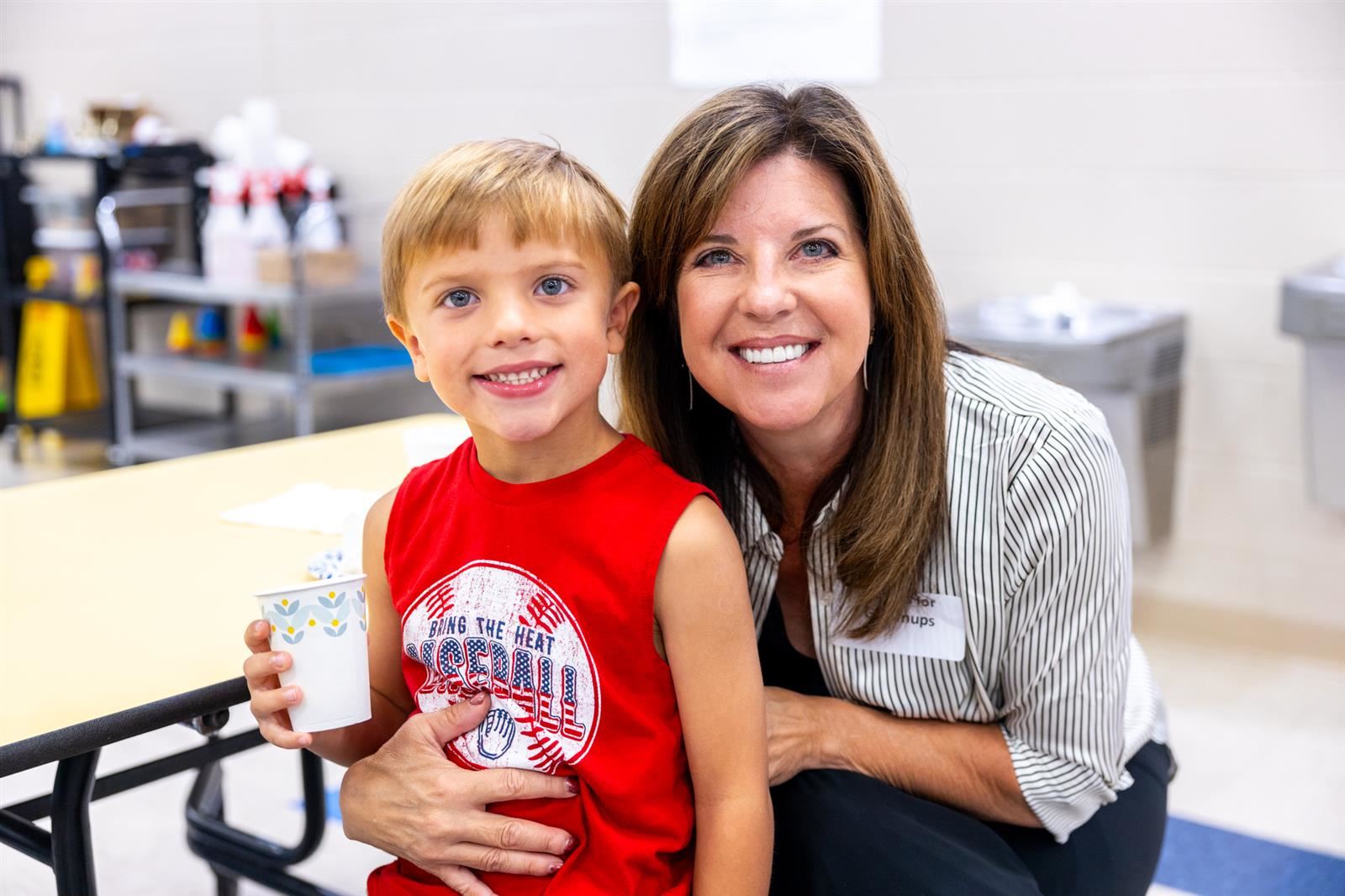 mom and son with a cup